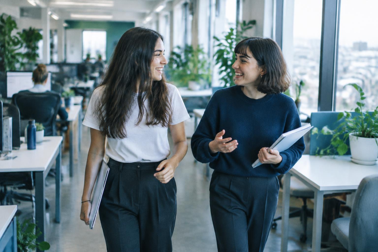 The founders walking and talking through the open-plan office